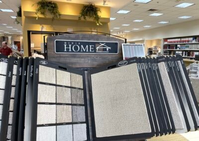 Blakley's Flooring – flooring sample wall with digital price labels