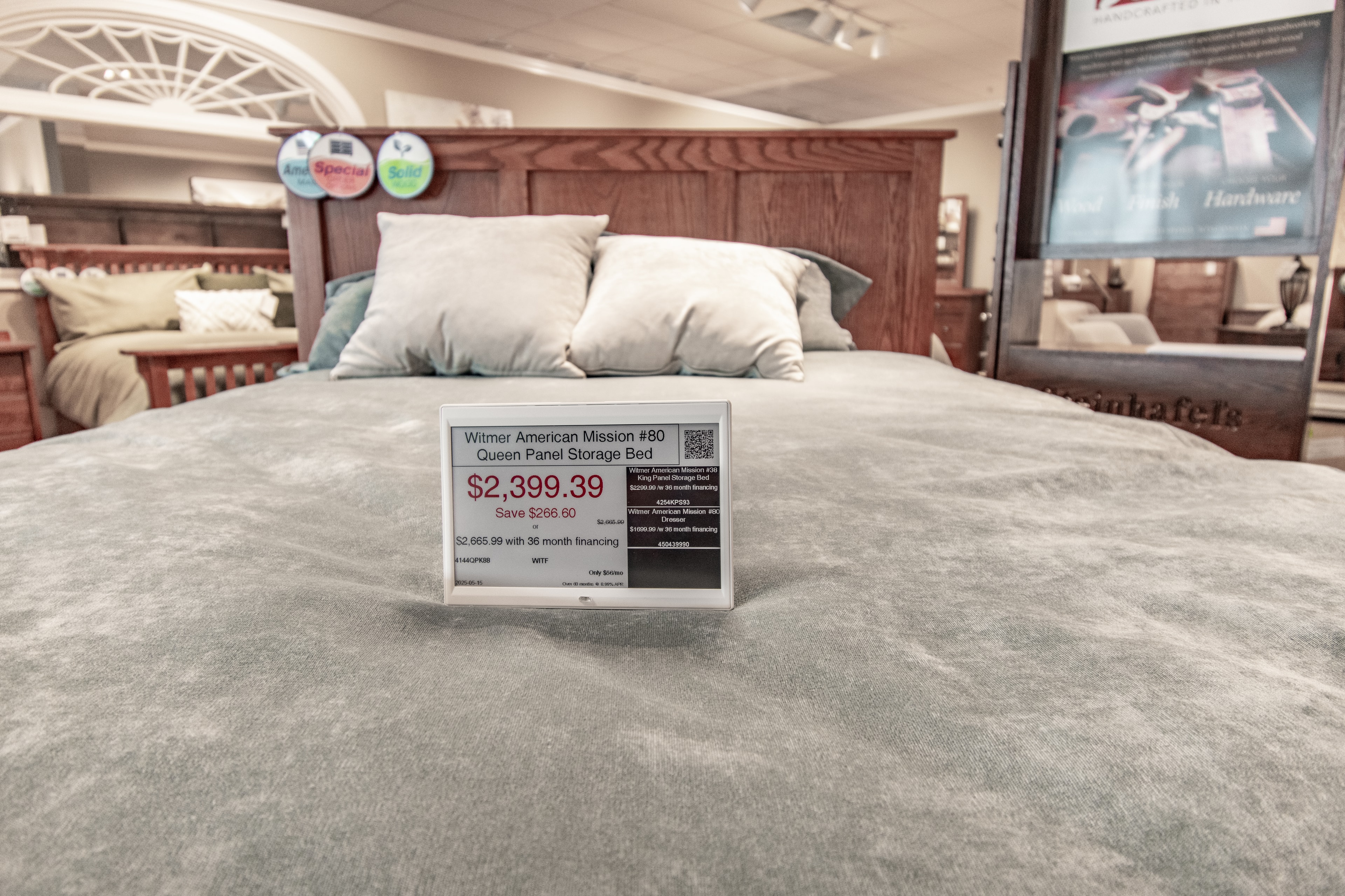 Steinhafels – bed display with ESL price tag in furniture showroom
