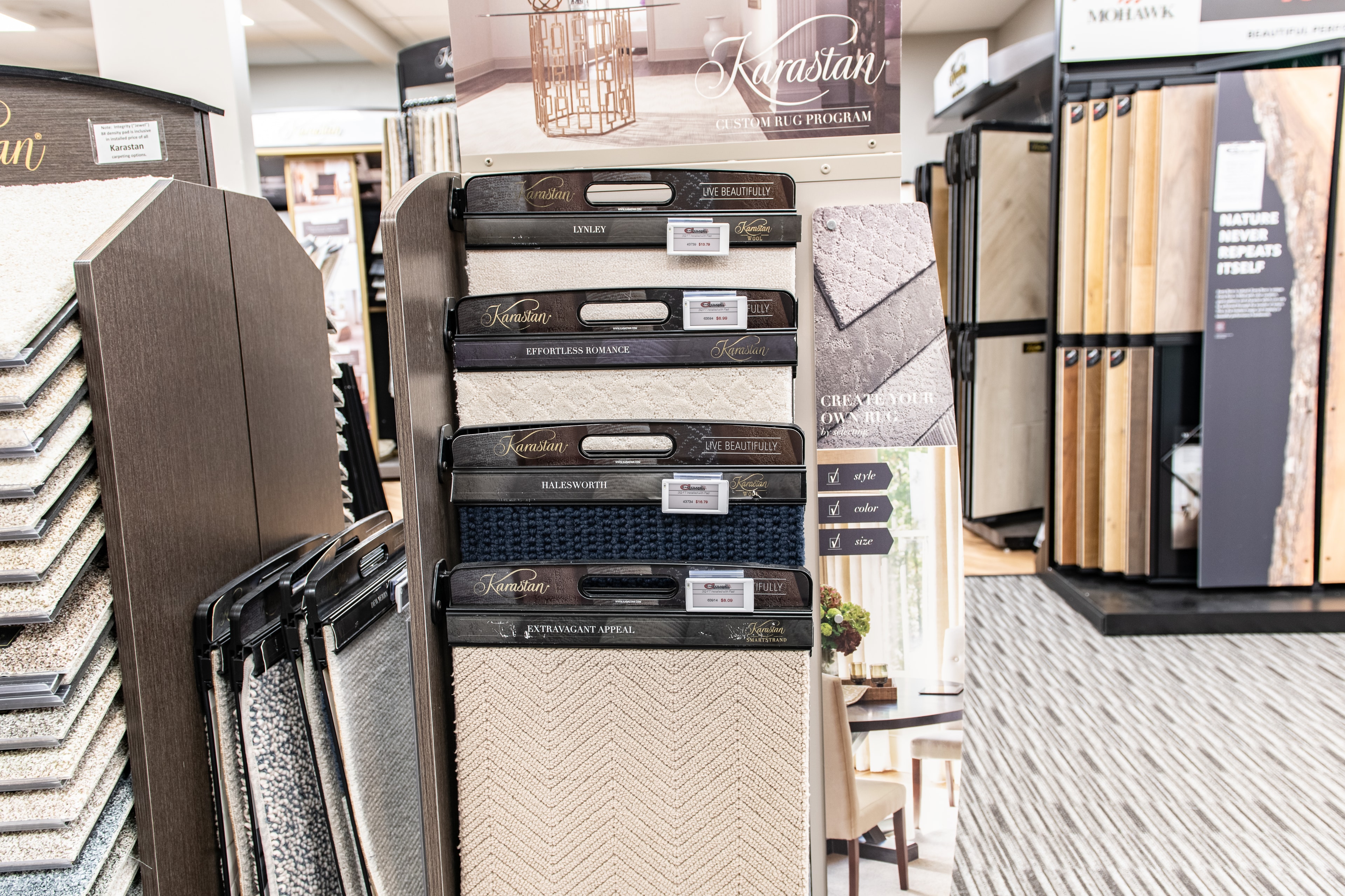 Carpetland USA – Karastan rug program display with ESL labels