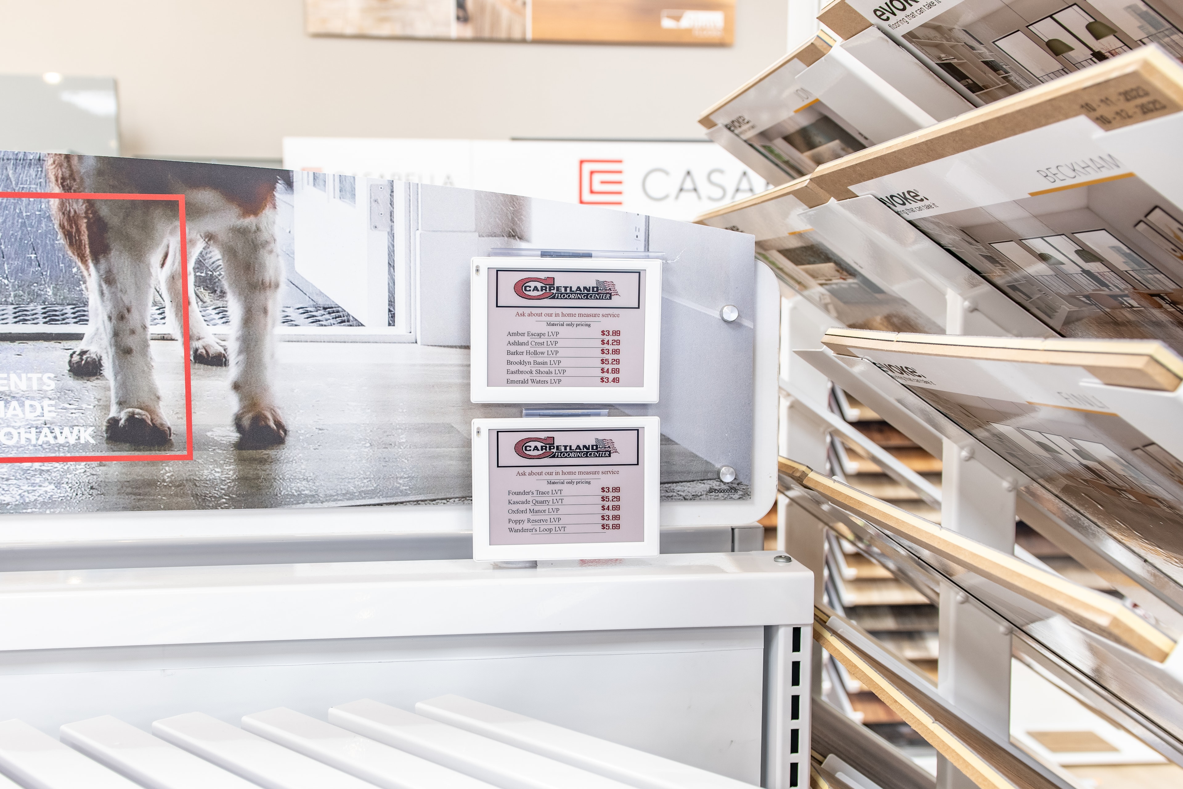 Carpetland USA – Casa and LVP flooring display with ESL price tags