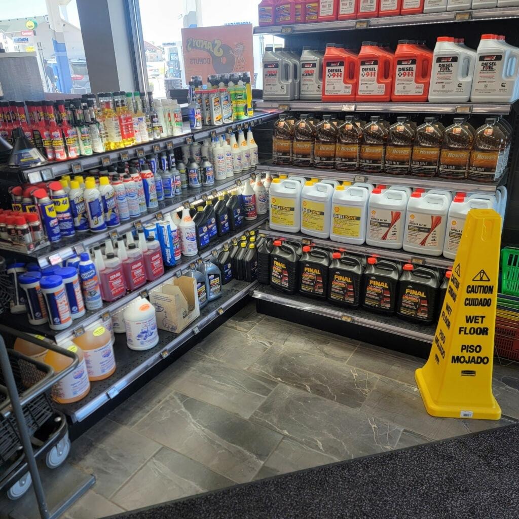 Petro Serve USA – automotive chemicals and additives aisle with ESL labels