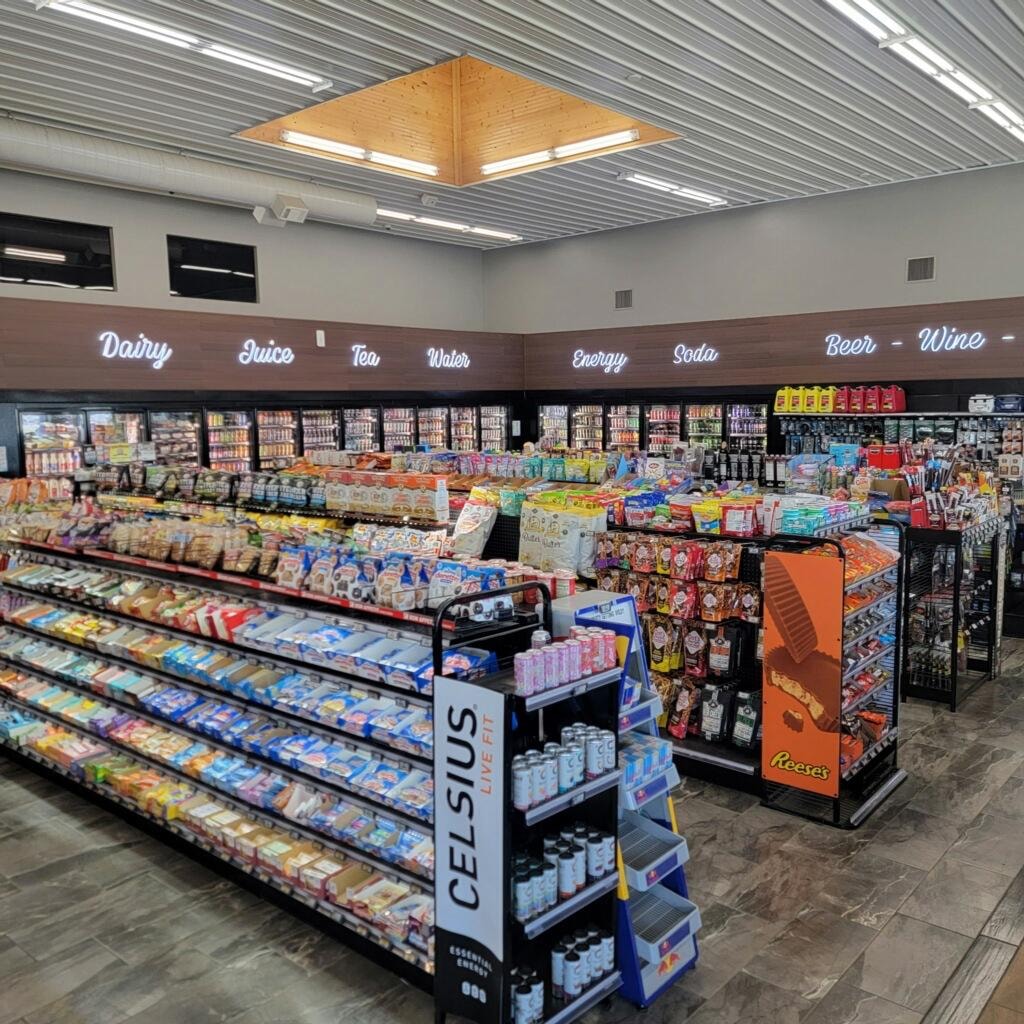Petro Serve USA – convenience store interior overview with ESL labels throughout