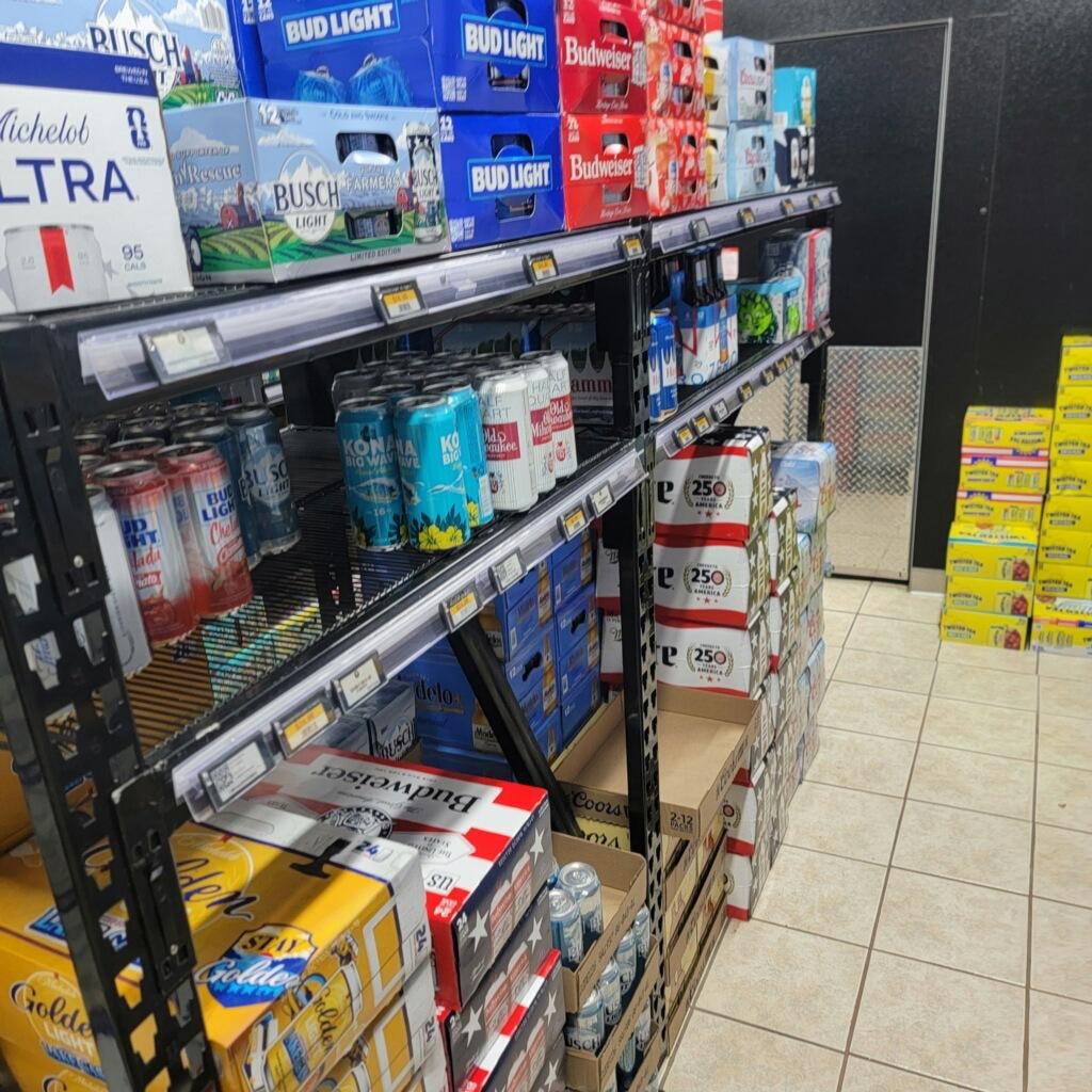 Petro Serve USA – beer and canned beverage shelf display with ESL price tags